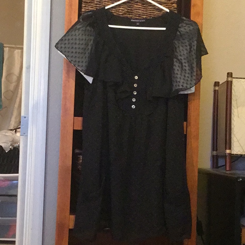 Baby doll style tunic with sheer sleeves.